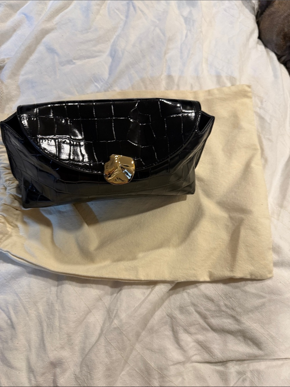 Flattered Black Croc-Embossed Patent Clutch with Gold Accent